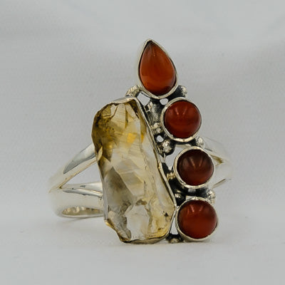 Rough rutilated quartz with 4 carnelians set in silver ring