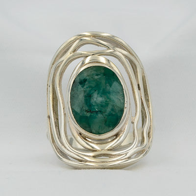 Rough green sapphire set in silver ring