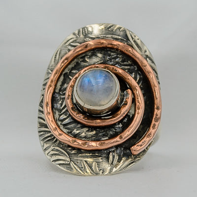 Sterling silver ring with a copper spiral and moonstone