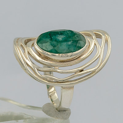 Rough green sapphire set in silver ring