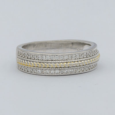 Sterling silver ring with cubics and a gold plated rope