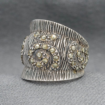 Sterling silver textured  ring with marcasite scrolls