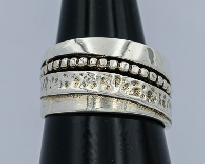 Sterling silver ring with flowing bands