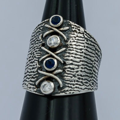 Textured oxidized silver ring with Iolite and crystal