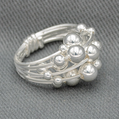 Sterling silver multiple wired ring with balls.