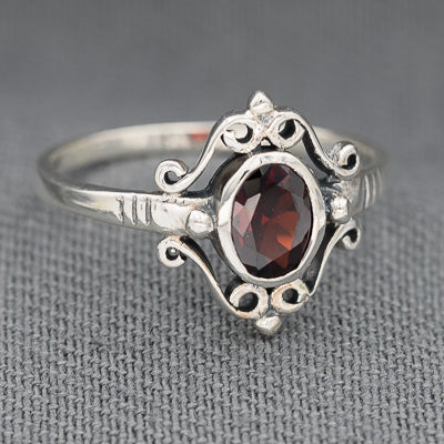 Sterling silver with a red cubic