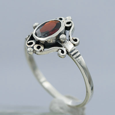 Sterling silver with a red cubic