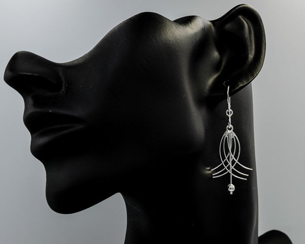 Sterling silver cross over dangling earrings