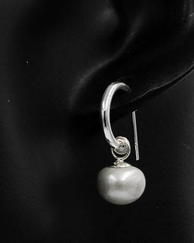 Pretty woman with a grey pearl