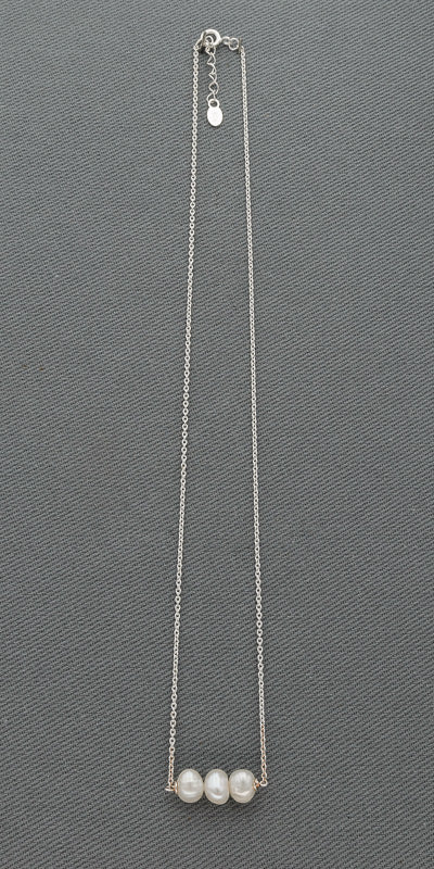 Thin  sterling silver chains with a pendant.